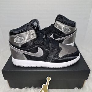 Nike Black and Silver High-Top Jordan Sneakers